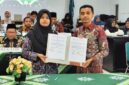 Kepala Perpustakaan USM Mulia Wati S.IP bersama Ketua FPPTI Aceh Nasrijal, S.IP (dok Humas USM)  